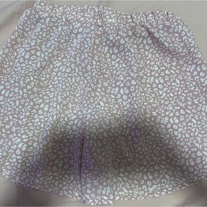 pink and white with brown button shorts that look like skirt